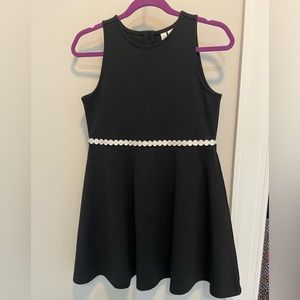 Black Janie & Jack sleeveless dress with white detail.